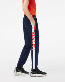 LACOSTE – Pantalon jogging – bleu marine et rouge